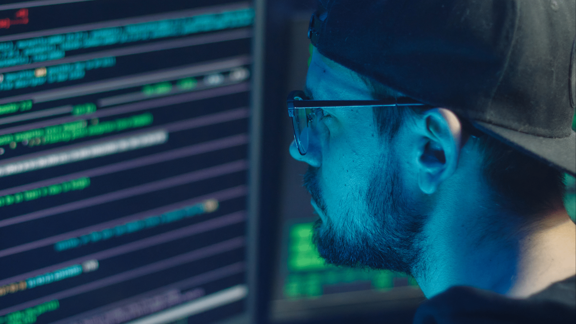 Man looking at code on computer