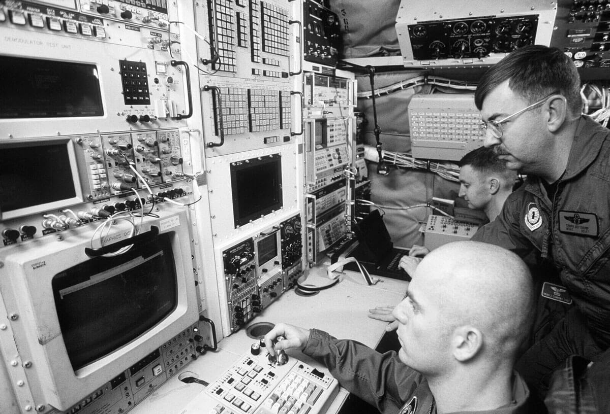 Military professionals working in a control room